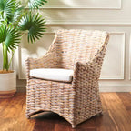 Poltrona in rattan con cuscino in cotone