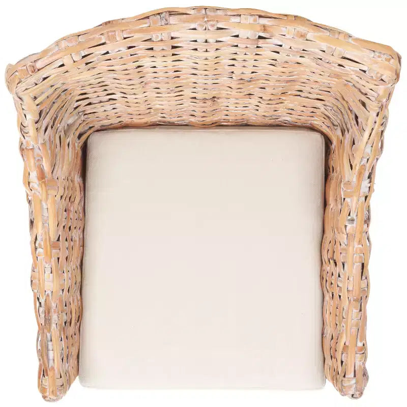 Poltrona in rattan con cuscino in cotone
