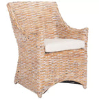 Poltrona in rattan con cuscino in cotone