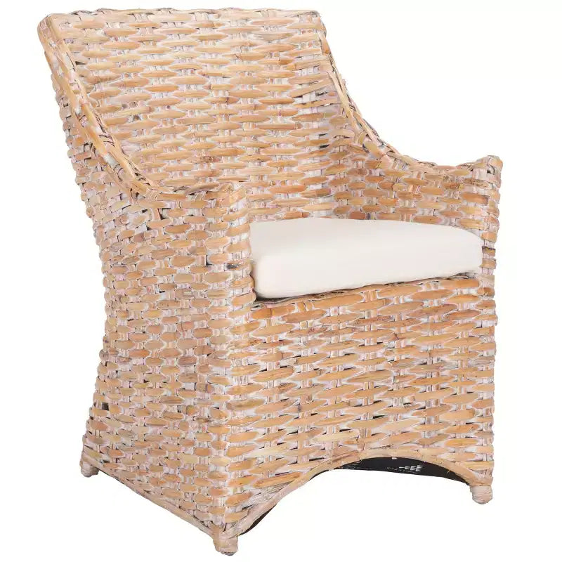 Poltrona in rattan con cuscino in cotone