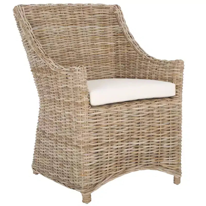 Poltrona in rattan con cuscino in cotone