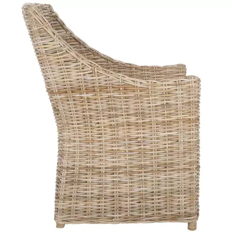 Poltrona in rattan con cuscino in cotone