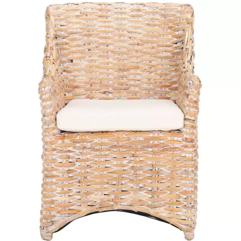 Poltrona in rattan con cuscino in cotone